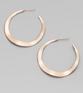 Simple, subtle wavy hoops, in sterling silver and 18k gold, glow with the warm finish of 18k rose goldplating.18k gold and sterling silver with 18k rose goldplatingDrop, about 1½PiercedImported