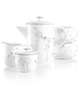 Wildflowers gleam in polished platinum, adding whimsical glow to the Silhouette tea set. A banded edge adds a classic touch to serveware, cups and saucers with modern spirit.