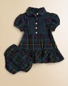 Classically preppy tartan plaid and a pintucked bib front complete a timeless woven cotton dress.Peter Pan collarShort puffed sleevesButton-frontRuffled hemCottonMachine washImported Please note: Number of buttons may vary depending on size ordered. 