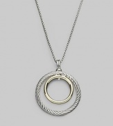 Double circles, one of cabled sterling silver, the other of smooth 18k gold, make a pretty pairing hanging from a silver box chain. Sterling silver and 18k yellow gold Chain length, about 17 to 18 Pendant diameter, about 1¼ Lobster clasp Imported