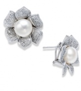 A true beauty. A cultured freshwater pearl (10 mm) and sparkling round-cut diamonds (1/10 ct. t.w.) adorn these exquisite flower-shaped stud earrings. Set in sterling silver. Approximate diameter: 1 inch.