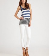 Sporty cotton scoopneck in allover bold stripes has an on-trend racerback and hits below the hips. ScoopneckSleevelessRacerbackLonger length hits below the hipsCottonHand washImported