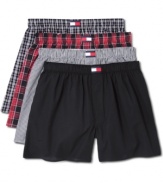 A four-pack wardrobe of cotton boxer shorts, here done in a palette of blacks and reds, from Tommy Hilfiger.