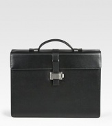 Single-gusset briefcase made of full-grain calfskin leather with a full, jacquard lining, ruthenium-plated metal accents and a unique lock closure.Top handleFlap front latch closureLeather14W x 10¼H x 4DMade in Italy