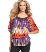 Spice up your look with a beaded tunic top from INC! The vibrant colors and lively print give it eye-catching appeal.