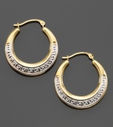 An age-old design symbolizing infinity and unity, the Greek key design looks decadent on these hoop earrings crafted in yellow and white 14k gold. Approximate diameter: 1/2 inch.