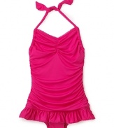 A ruffle skirt and shirring add a sweet touch to this halter swimsuit from Juicy Couture.