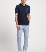 Soft and simple, with an unexpected sleeve and chest pocket detail.Three-buttonCottonMachine washImported