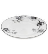 Compose a striking arrangement with the Black Orchid oval platter by Michael Aram. Fine white Limoges porcelain flourishes under a dark watercolor motif inspired by foliage from around the world.