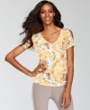 An abstract print, shiny studding and split-sleeve detail makes this petite top from INC super striking.