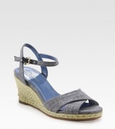 Denim canvas style with an adjustable, wrap-around ankle strap and traditional espadrille wedge. Hemp-covered wedge, 2½ (65mm)Hemp-covered platform, ½ (15mm)Compares to a 2 heel (50mm)Denim upperLeather liningRubber solePadded insoleImportedOUR FIT MODEL RECOMMENDS ordering true size. 