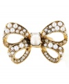 Bow-dacious! Made a bold style statement with this large-scale bow stretch ring from Betsey Johnson. Accented by glass pearls and sparkling clear crystals, it's made in gold tone mixed metal. Ring adjusts to fit finger.