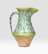 A verdant garden patio piece is handcrafted and individually painted with tall flowers and sherbet-hued stripes by master ceramics artisans. For an especially one-of-a kind touch, each piece bears the hand-placed stamps of the artisans who created it. Dishwasher- and microwave-safe 12-ounce capacity 12H X 7½ diam. Made in USA