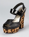 With a leopard printed heel and platform, these GUESS sandals make a slick statement for day or night.