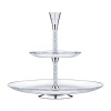 This two-tiered cake stand turns every tea and coffee time into a special occasion. Elegant and functional, it can be used either traditionally for chocolates and fruit or as a purely decorative display. It consists of five parts, including two glass plates that are food safe. The 600 crystals in the central column and the fully cut crystal top part with 24 facets make this a truly unique home accessory.