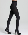 Two pairs of tights in one! Reversible tights that reveal a different color when turned inside out. Includes SPANX® slimming panels for a sleek silhouette.