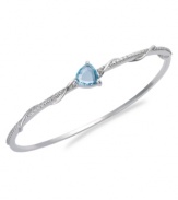 The perfect accent. Victoria Townsend's beautiful bangle features a trillion-cut blue topaz (3 ct. t.w.) and sparkling diamond accents. Set in sterling silver. Approximate length: 8 inches.