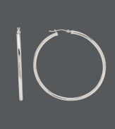 Style that's simple, but still makes a cool statement. Earrings feature a traditional hoop design and click backing set in polished, 14k white gold. Approximate diameter: 2 inches.