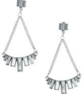 Chandelier chic from GUESS. These drop earrings flaunt baguette-cut crystal stones placed in a row, strung from linked chains. Crafted in imitation rhodium tone mixed metal. Approximate drop: 3 inches.