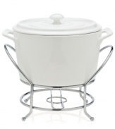 At once elegant and utilitarian, the Cucina warmer transitions flawlessly from oven to table and will keep your food piping hot, set in a silvertone metal rack. A must for the consummate host, from Godinger.