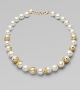 An exquisite strand of graduated pearls accented with 18k gold flower cup caps.14mm & 16mm round white organic man-made pearls18k goldplated sterling silverLength, about 16 to 18 adjustableLobster clasp closureImported 