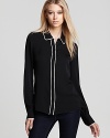 Add masculine edge to your wardrobe with this monochrome silk button down from Rachel Zoe.