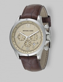 Superior style in stainless steel with heritage-inspired chronograph detail on an embossed leather strap. Quartz movement Water-resistant to 10 ATM Stainless steel case Round case; 44mm diameter (1.73) Three chronograph sub dials Arabic numerals and hour markers Date display at 4:00 Second hand Embossed leather strap Imported 