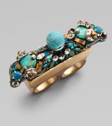 Richly veined turquoise and shimmering rhinestones are joined by embroidered beads and golden accents in this dramatic design that slips over two fingers.Turquoise Rhinestones Goldtone Width, about 2¼ Made in USA