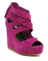 Thick straps crisscross over these sharp suede wedges, complete with jaunty tassels and smart back zippers. By Dolce Vita.