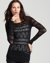 Boasting a lacy pointelle weave in luxurious wool, this Theory sweater brings ease and elegance to fall weekends.