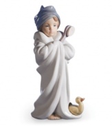 Bundled up after a bubble bath with her yellow baby duckie, this porcelain cutie is a charmer for your bathroom's cabinet or shelf. Handcrafted by Lladro.