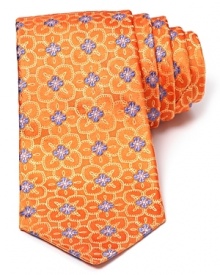 A subtle floral print takes form on luxe silk with this classic tie from Ike Behar.