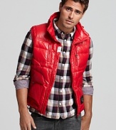 Diesel's down vest is fierce in slick red nylon, featuring a drawstring collar and practical pockets.