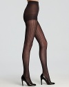 Opaque diamond patterned tights look great on their own or layered with knit socks for a cool, wintry look.