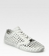 Sporty, modern lace-up design in woven leather.Leather liningPadded insoleRubber soleImported