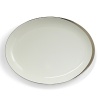 A hand-painted crescent of stunning platinum rims the edges of this thoroughly modern dinnerware collection.