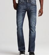 Artful distressing lends downtown cool to these slim bootcut jeans from Buffalo.