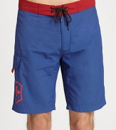 Contrasting waistband adds a splash of color to this all-time beach favorite.Drawstring tie waistSide cargo pocketInseam, about 9NylonMachine washImported