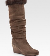 Slightly slouched, weatherproof suede style topped off with a plush rabbit fur trim. Crepe wedge, 3 (75mm) Shaft, 14½ Leg circumference, 15 Rabbit fur cuff Weatherproof suede upper Faux fur lining Rubber sole Padded insole ImportedOUR FIT MODEL RECOMMENDS ordering one half size up as this style runs small. 