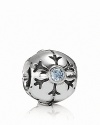 A delicately etched snowflake with a sparkling aqua zirconia center adorns this sterling silver charm by PANDORA.