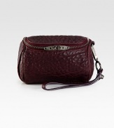 Luxurious textured leather with a convenient wrist strap.Wrist strap, 6½ dropTop zip closureFully lined6W X 4H X 4DImported