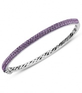 Slim, stackable style. Kaleidoscope's thin shimmering bangle makes a statement all its own, but can also be stacked with similar styles for a trendy layered look. Features round-cut purple crystals with with Swarovski Elements. Set in sterling silver. Bracelet features a hinge clasp. Approximate diameter: 2-1/2 inches.