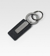 Sleek design of textured leather and metal accented with engraved signature logo.About 4 longMade in Italy