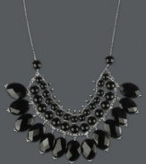 Create a standout statement in bold black hues. Rows of round and oval-cut onyx (172-3/4 ct. t.w.) create a fringe effect within a delicate sterling silver setting. Approximate length: 17 inches. Approximate drop: 1-1/2 inches.