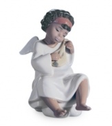 End your day on a high note, in the presence of this beautiful angel. Handcrafted in Lladro porcelain, she makes any heart sing.