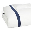 A classic navy sateen border trims this elegant duvet cover by SFERRA, woven from super soft Egyptian cotton.