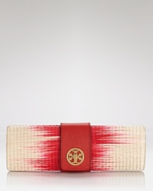 Accented with gold hardware and trimmed in leather, Tory Burch's woven straw clutch is the ticket to glamorous getaway style.