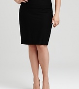 A simple Eileen Fisher skirt lends versatility to workday style with a sleek, slim silhouette. A fold-over waist updates the look for a modern finish.