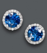 Studs add simple, yet spectacular, definition to your look. Effy Collection's chic design highlights round-cut sapphires (2 ct. t.w.) encircled by round-cut diamonds (1/5 ct. t.w.). Crafted in 14k white gold. Approximate diameter: 1/3 inch.