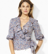 Rendered airy, lightweight cotton in a feminine wrap silhouette, this ruffled Lauren Jeans Co. blouse exudes vintage-inspired romance with a charming floral print.